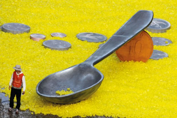 Man standing with giant spoon and coins, World Vision charity event