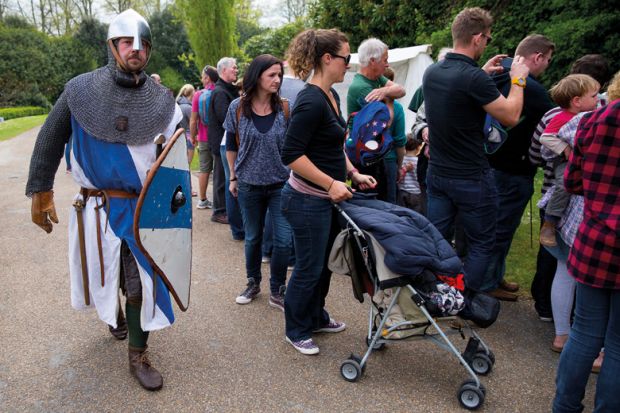 Man taking part in battle reenactment, Arundel Castle, England