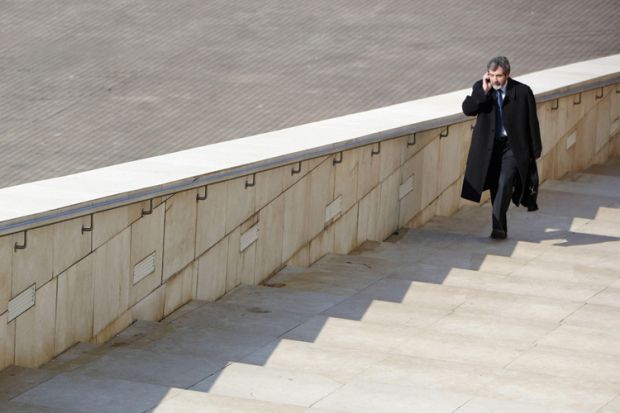 Man walking up steps Guggenheim Museum, Bilbao, Spain