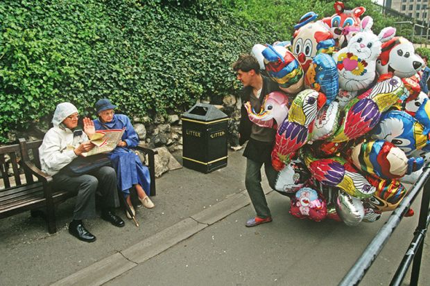 Man with lots of balloons