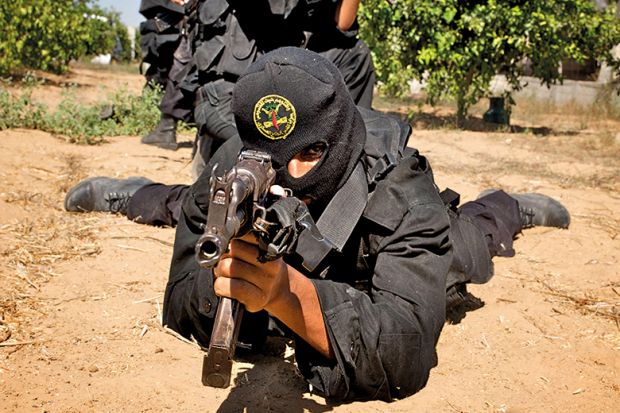 Armed man wearing balaclava