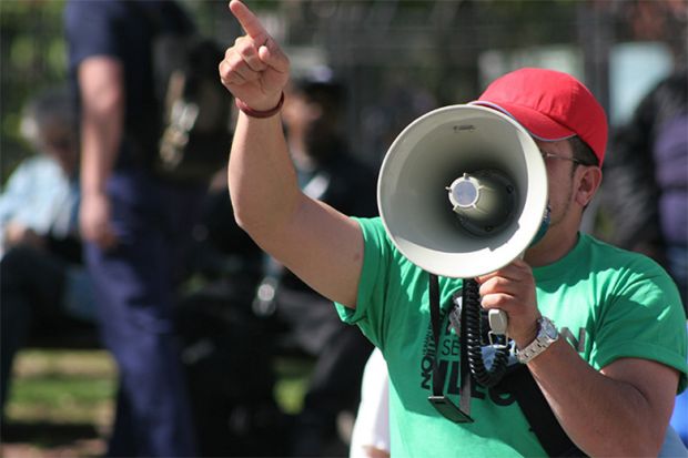 Man shouting into a megaphone