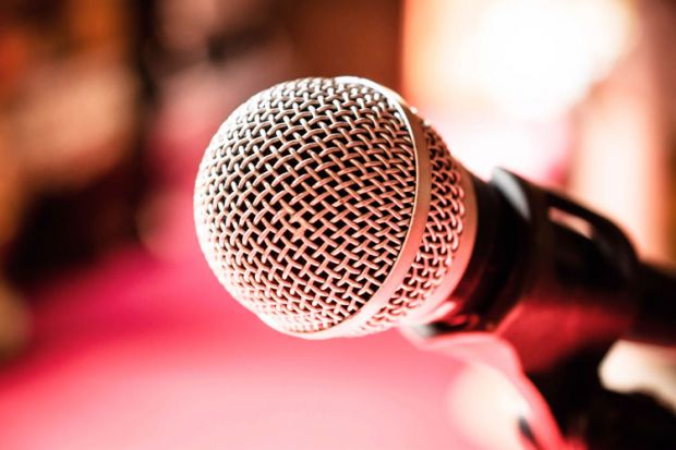 Microphone against red background (detail)