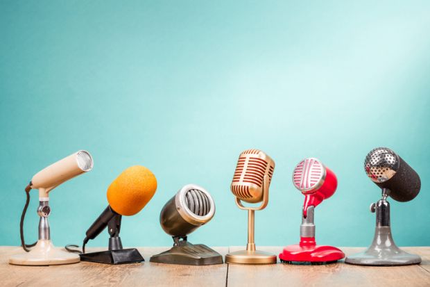 A row of microphones, symbolising media engagment