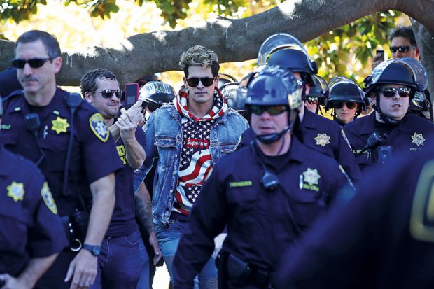 Milo Yiannopoulus surrounded by police