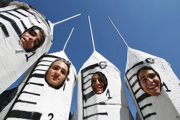 People dressed in syringe costumes