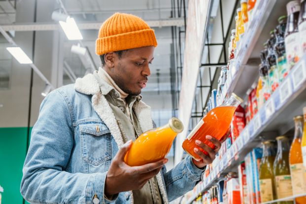 A man chooses between groceries, illustrating degree choice