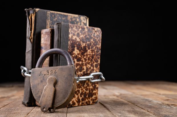 Padlocked books, symbolising restrictions on liberal arts