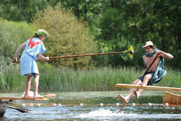 Participants fight during Fischerstechen fishermen joust competition