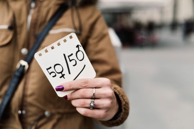 A woman protests against the gender pay gap