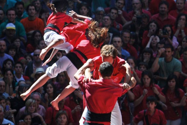 People collapse while building human tower