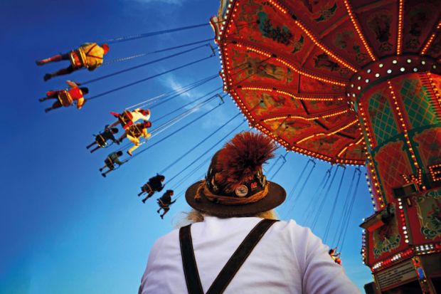 People riding on fairground ride