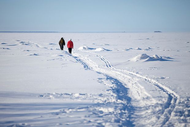 People walking through snow