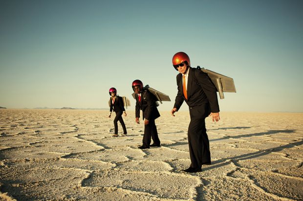 Three people wearing jetpacks