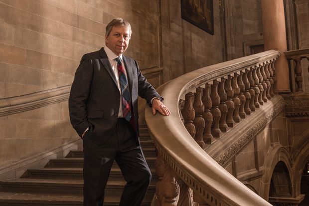 Peter Mathieson, the former head of the University of Hong Kong and vice-chancellor of the University of Edinburgh standing on a staircase