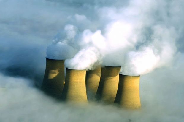 Power station chimneys engulfed in fog