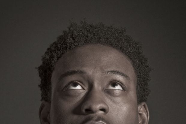 Profile of young male student looking up