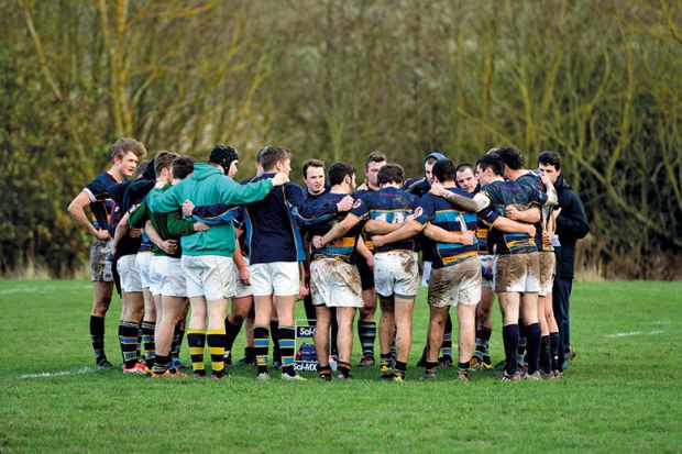 Rugby team huddle