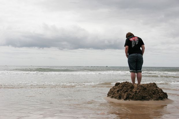 sandcastle with rising tide