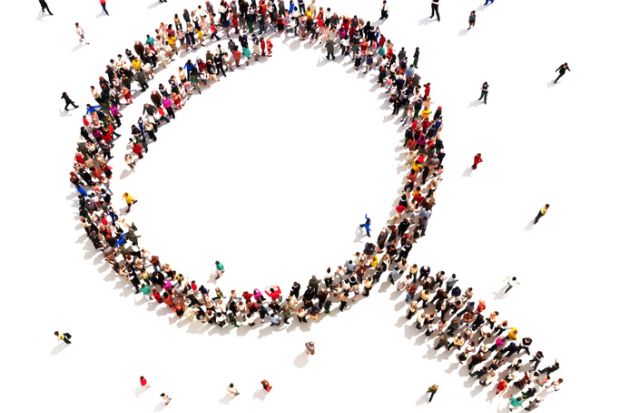 Large group of people in the shape of a magnifying glass, symbolising shared vision