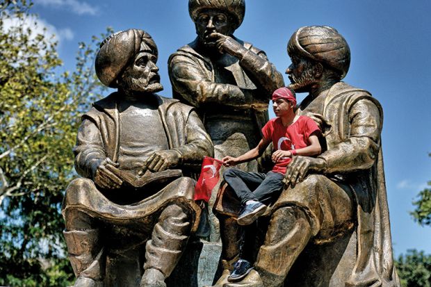 Sitting on a statue in Turkey