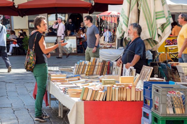 Discussion at bookstall in market