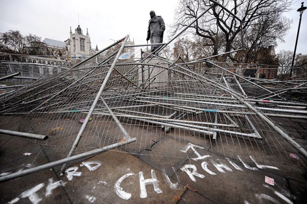 Statue of Winston Churchill, broken security barriers, Parliament Square, London