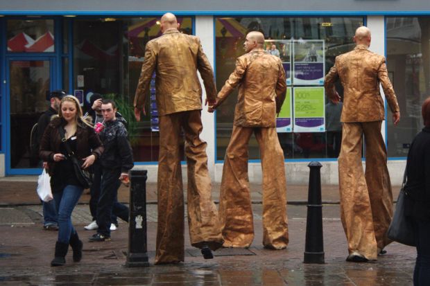 Stiltwalkers down high street