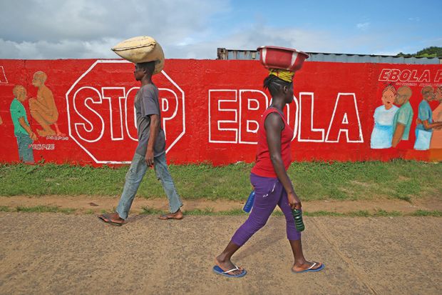 Stop Ebola sign written on wall