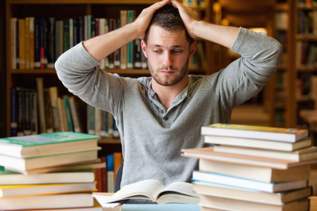 A tired student in the library