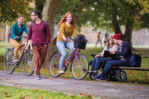 Students going through park