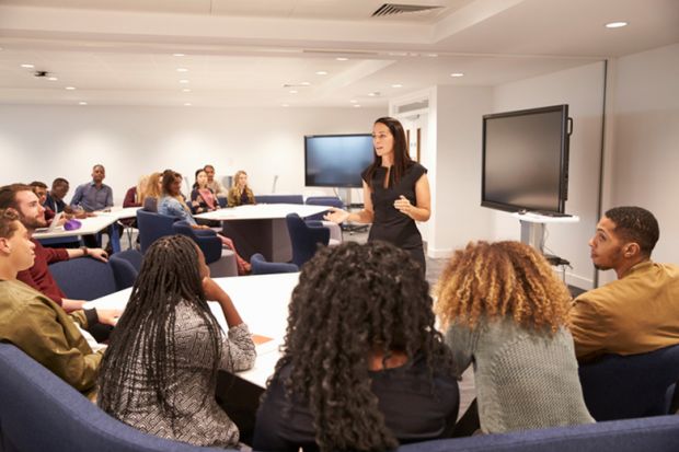 A university teacher in a classroom