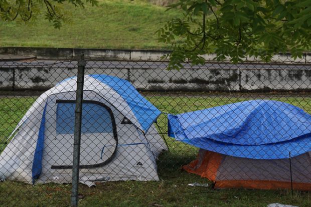 Tents behind a fence