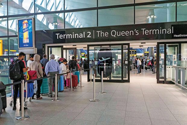 People wait in line at terminal 2, Heathrow