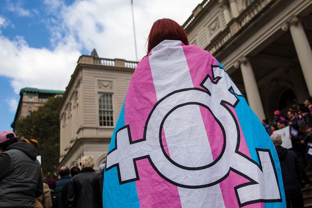 Person with transgender flag