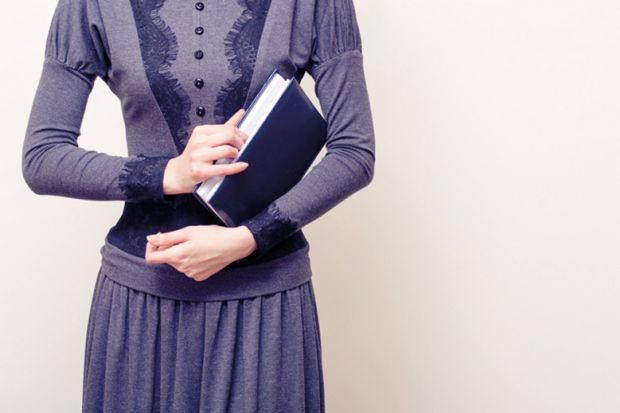 Victorian woman holding book