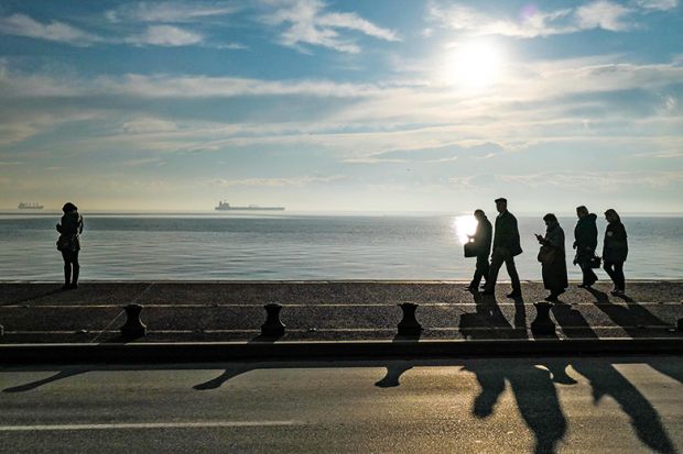 people walking on beach