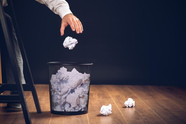 A wastepaper basket illustrating an opinion article about discrimination against non-native English speakers in journal publication