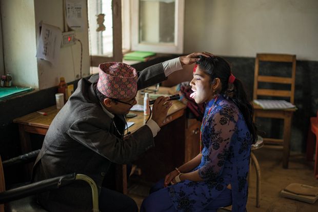 Woman getting check up at doctors