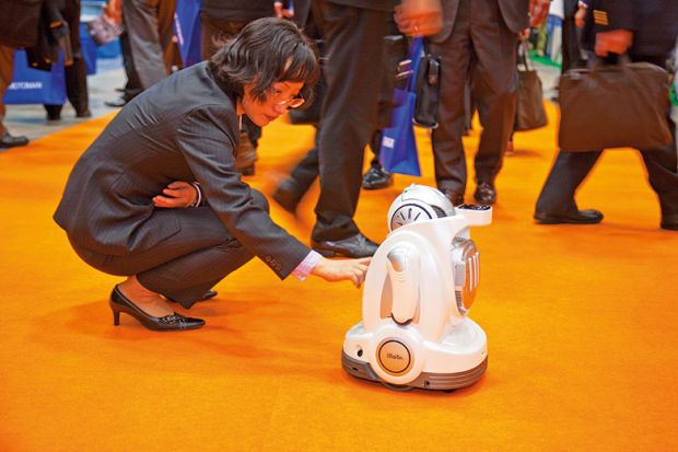 Woman interacting with robot