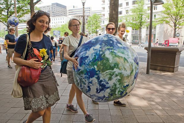 Women carrying the world