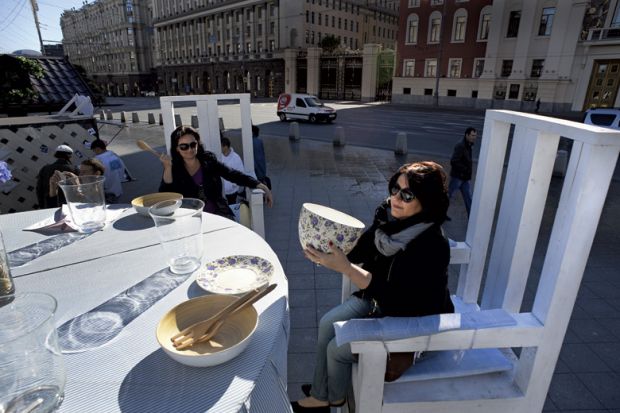 Women sitting at giant table