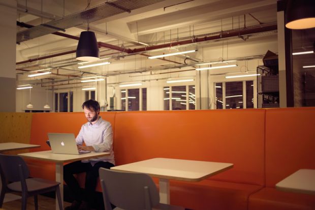 Man working on laptop alone