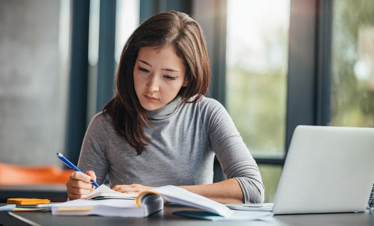 Female student working at a computer