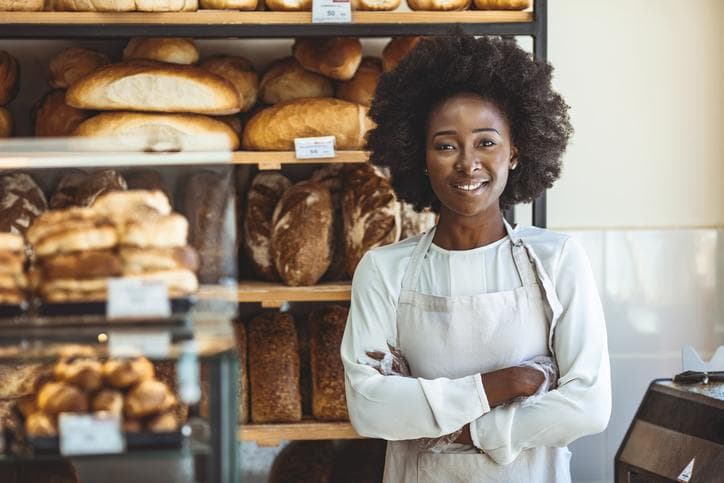 happy woman in small bakery